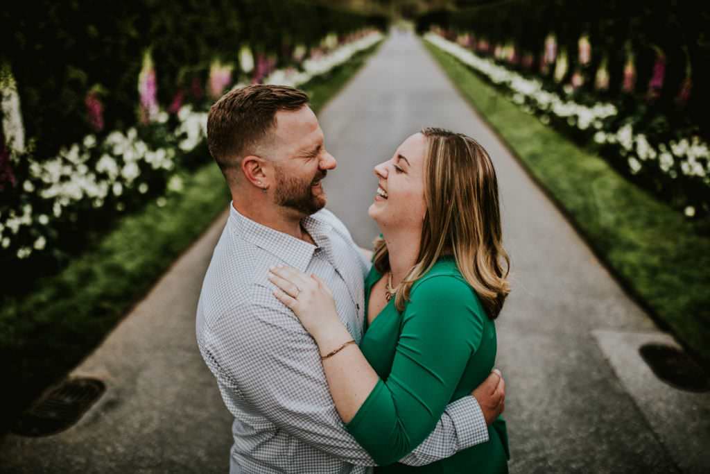 couple laughing in longwood gardens