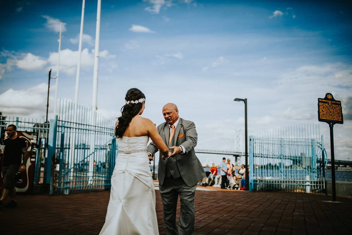 Father looks at bride