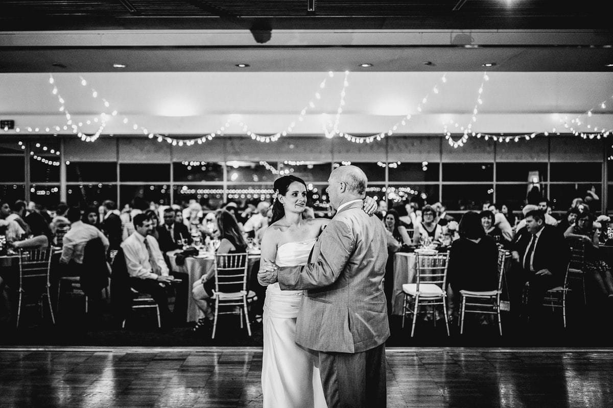 father dances with daughter at wedding