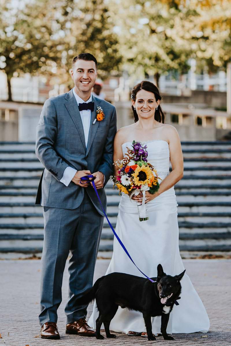 bride and groom with pet