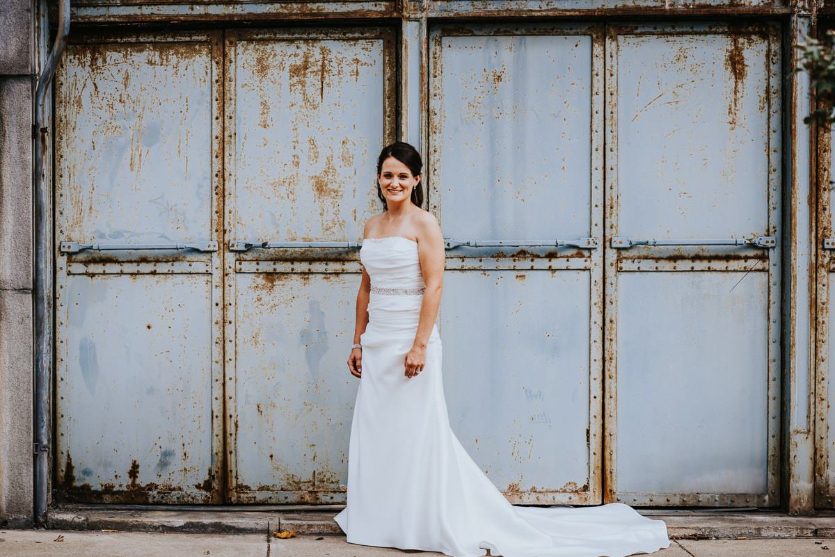 bride in front of wall