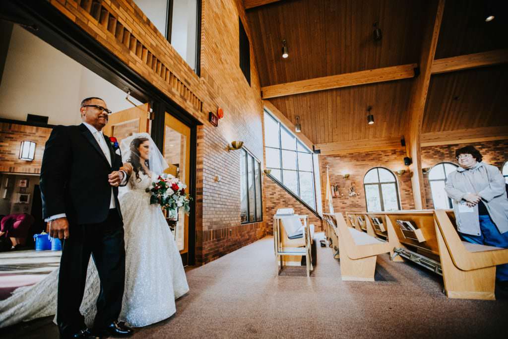 father walks bride down the aisle