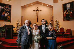 bride ad groom with grandparents