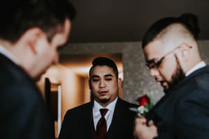 photos of groom getting ready